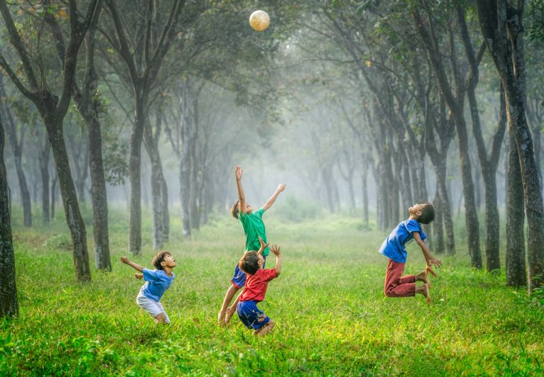 deschooled children playing with ball